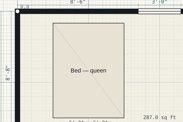 A corner of the plan: two thick walls meeting at a square joint, with an 8 foot 6 inch dimension string above them.